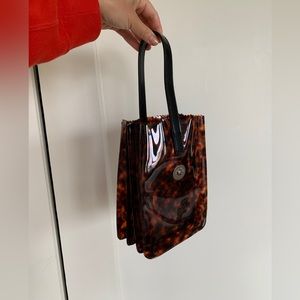 Kara tortoise pinch wristlet purse